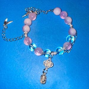 Lavender and clear beaded bracelet with charms